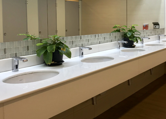 View inside of a commercial bathroom showcasing the sinks