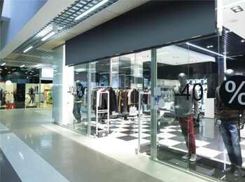 View inside of a mall showing a store front
