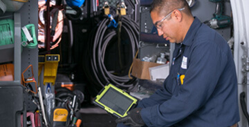 HVAC technician working on HVAC maintenance services