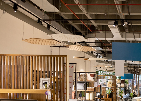 View of a ceiling at a retail store that has exposed HVAC piping