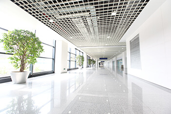 All white hallway inside of an upscale commercial office building